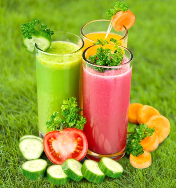 Glasses with fresh tasty vegetable juices